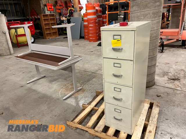 Lot 30-3994 - Lot includes one filing cabinet and (2) desks