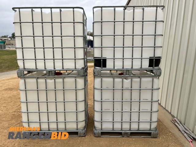 Lot 30-3303 - (4) Schultz 250 gallon stackable liquid storage containers Plastic with metal cage 250 Gallon Containers No leaks, Good Condition.