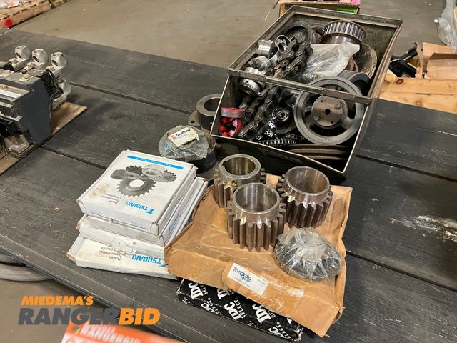 Lot 30-2430 - Box of gears, sprockets, pulleys, and hub Some new, some used.