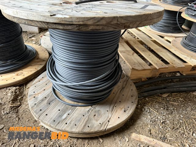 Lot 30-5753 - (1) partial spool of 9 strand black coated copper cable.