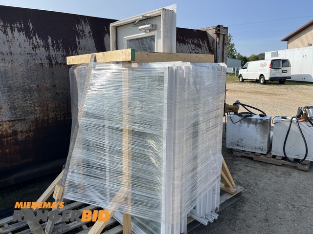 Lot 30-1897 - Pallet of windows and 1 door Most are approximately 5' x 5'