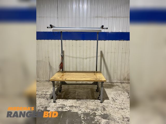 Lot 30-69 - 60 x 35.5 X 29.25 Work Bench Table with 1.5" Wood Top Table Height 
The table was set up to have an ...