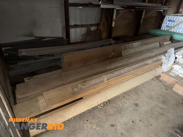 Lot 30-5737 - Entire contents of lumber shown on floor, includes (1) 14' long x 12" x 5.5" laminated beam, (3) 22'...