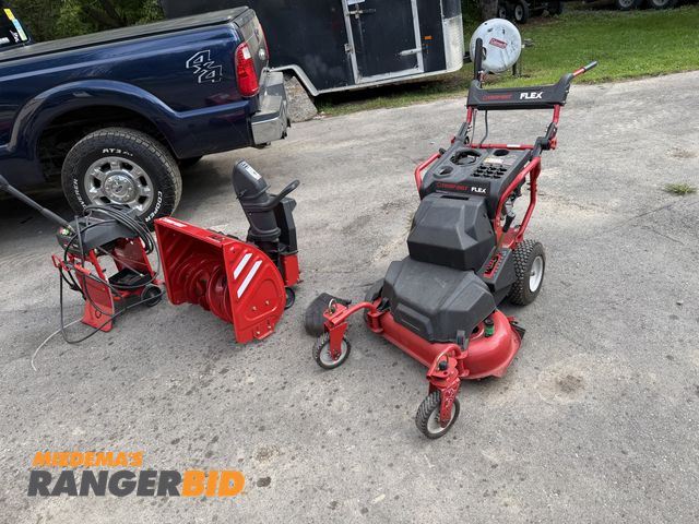 Lot 30-11405 - Troy Bilt Flex Self-Propelled Lawn Mower Comes with mower, snowblower and power washer attachments. ...