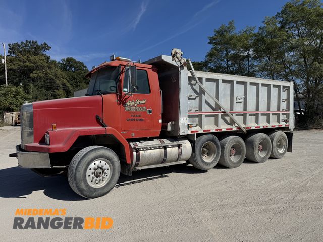 Lot 30-7674 - 1999 Volvo ACL Quad Axle Dump Dump Truck Tag axle does lift but has an air leak.