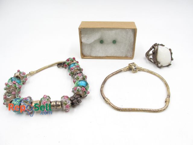 Lot 31-9018 - Jewelry Lot: (2) Pandora bracelets, .925 large stone ring size 7, tiny earrings.