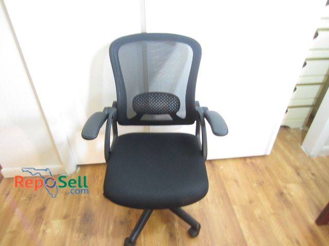 Lot 31-8649 - Black Mesh Office Chair With Adjustable Armrests And Rolling Base