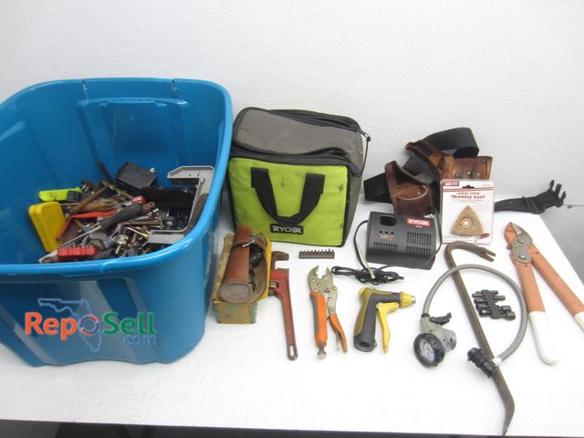 Lot 31-9466 - Tool Lot: 18V Charger, Bits, Pipe Wrench, Holster, etc.