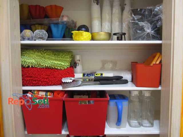 Lot 31-1341 - Contents of Left Side (4 Shelves): Kitchen Supplies, Candles, Reynolds Wrap, (2) Rugs, etc. - Totes ...