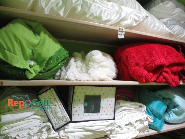 Lot 31-1311 - Contents of 4 Shelves: (5) Pillows, Approx (4) Throw Blankets, (2) Twin Sets of Sheets, Misc Bedding...