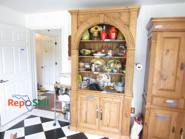 Lot 31-9199 - Natural wood hutch (No Contents)  *Please schedule pick up after 12pm* 88 inches in height, 43 inche...