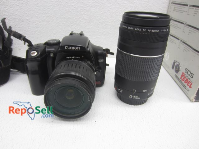 Lot 31-9062 - Rebel EOS  Canon Camera With 75-300 MM Lens, Bag, Original Box, (2) Batteries And Charger