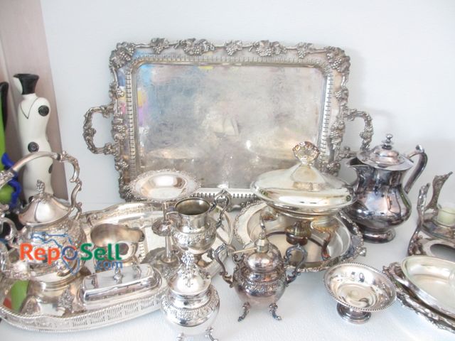 Lot 31-1450 - Large Lot of Silver Plate Serving Dishes, Tea Pots, Candle Holders, etc.