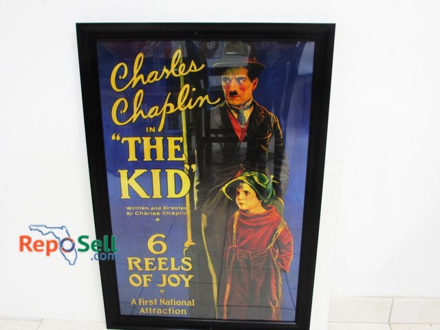 Lot 31-1232 - Framed Charlie Chaplin "The Kid" Movie Poster: Under Plastic; 39" x 28"