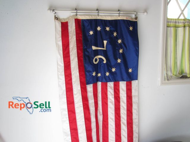 Lot 31-9149 - Nyl-Glo 13-star United States flag with '76' design in the blue canton, referencing the Betsy Ross p...