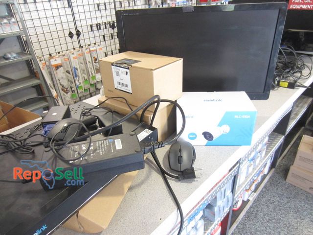 Lot 31-1376 - A Reolink Network Video Recorder (Model RLN8-410) And Five Security Cameras (Likely RLC-510A). Camer...