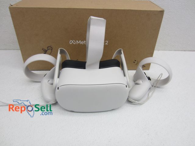 Lot 31-1093 - Meta Quest 2 VR Headset and (2) Controllers, Box - Powers On - Missing Power Cord