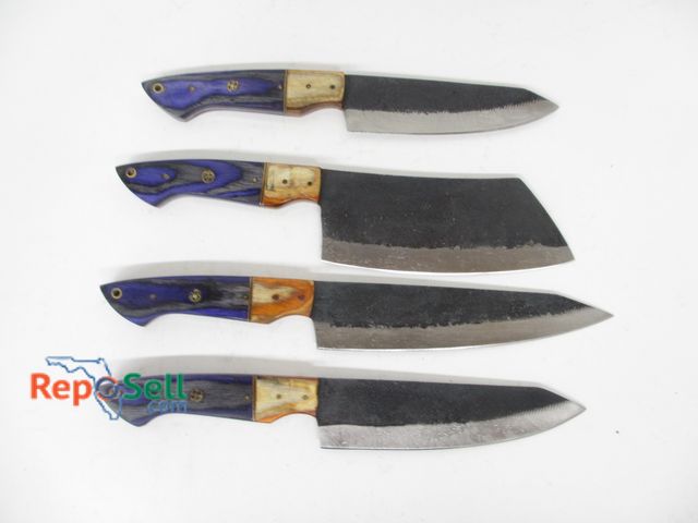Lot 31-7079 - (4) Damascus-style kitchen knives