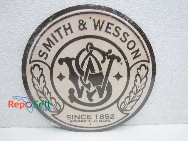 Lot 31-2275 - Metal Smith &amp; Wesson Round Sign 11.5"