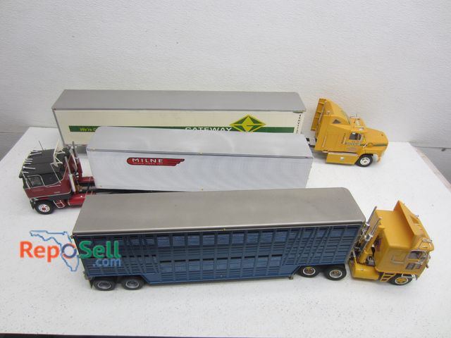 Lot 31-9230 - (3) Assorted Truck Cabs and Trailers 1:24 Scale