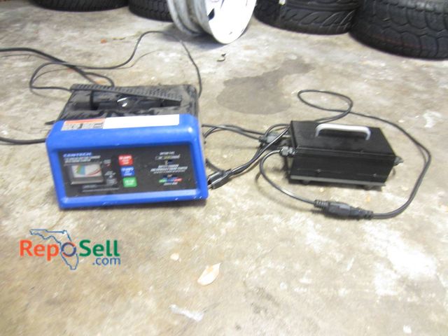 Lot 31-1252 - (2) Battery Chargers Both Power On: Cen-Tech 12V 10/50A Charger And Black Ribbed Unit With Cables