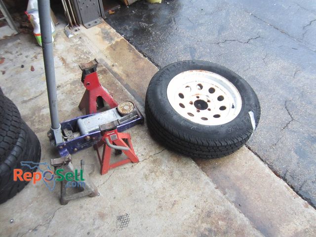 Lot 31-1278 - Sport Trail ST205/75D15 Trailer Tire With White Steel Wheel, 3 Jack Stands, Floor Jack