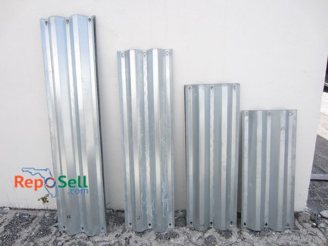 Lot 31-3310 - (23) Hurricane/Storm Shutters: (9) 64.5", (3) 55", (4) 37", (7) 44.5"
