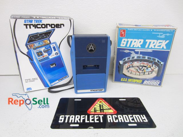 Lot 31-1245 - Star Trek AMT model kit USS Enterprise, Star Trek tri-corder (missing tape) and license plate