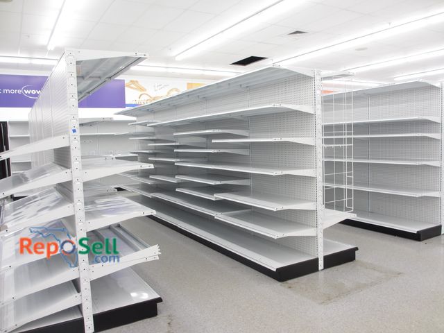 Lot 31-3067 - (3) Rows Double Sided Madix Peg Board w/ Shelves. Buyer Must Disassemble &amp; Remove.