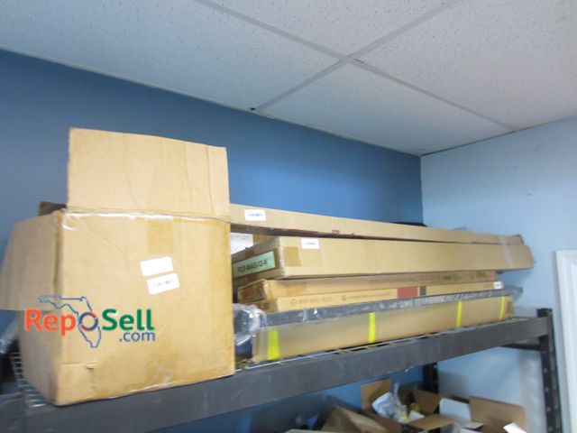 Lot 31-8300 - Contents of Top shelf: Pick up Wednesday Evolution Wine Rack parts, solid brass door hinges,  etc