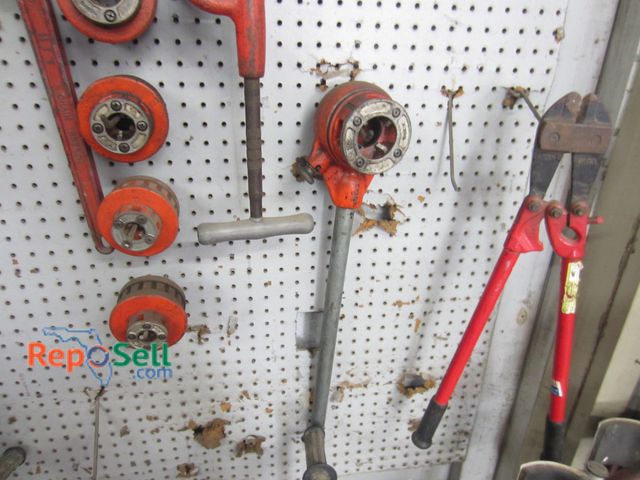 Lot 31-1060 - Tool lot on peg board: pipe wrench, threaders, bolt cutters, etc. - Pegboard not included