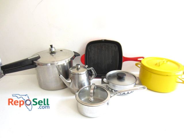 Lot 31-9176 - An aluminum Presto pressure cooker, a stainless steel Cuisinart saucepan with lid, a small stainless...