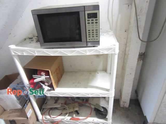 Lot 31-1280 - Emerson Microwave Oven, (3) Empty Fire Extinguishers, White Plastic Shelving Unit