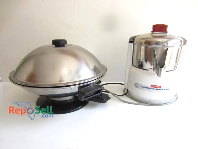 Lot 31-9177 - Acme Supreme Juicerator stainless steel with a spout and labeled front. Includes a Kenji electric wo...