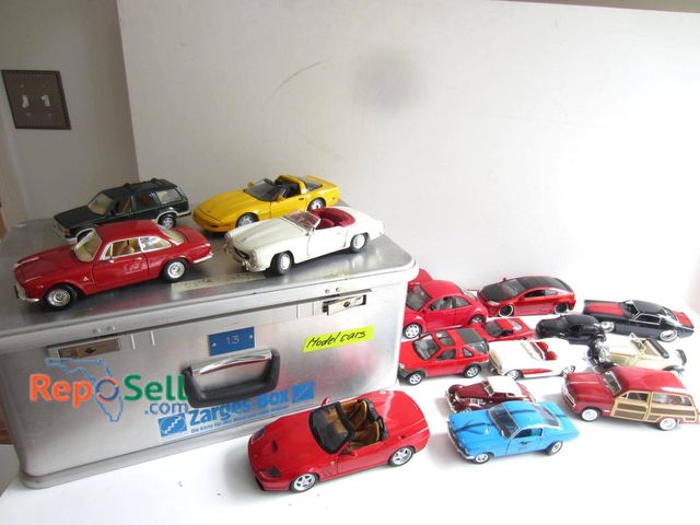 Lot 31-9302 - Various scale model cars in different styles and colors, including sedans, convertibles, and SUVs. I...