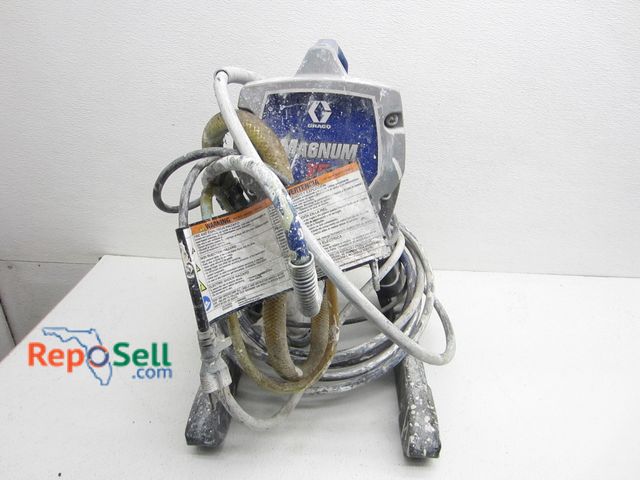 Lot 31-2512 - Graco Magnum X5 Paint Sprayer With Hose And Gun - Power On