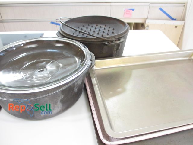 Lot 31-1175 - (2) Cast Iron Cooking Pots And Baking Sheets
