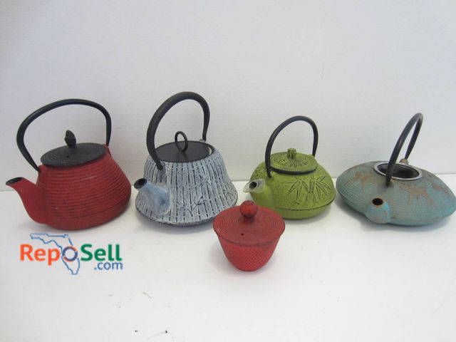 Lot 31-9087 - Four Cast Iron Teapots and One Covered Cup Featuring Bamboo, Floral, And Abstract Patterns, Includes...