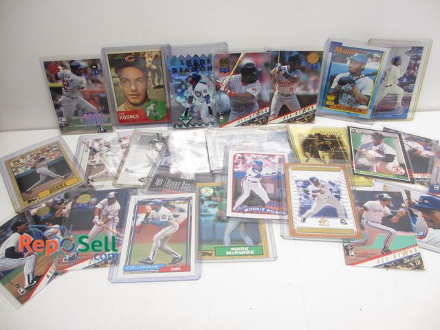 Lot 31-6024 - (25) baseball cards in sleeves: Ripken Jr., Boggs, Mookie, Bonds, Puckett, 1963 Koonce