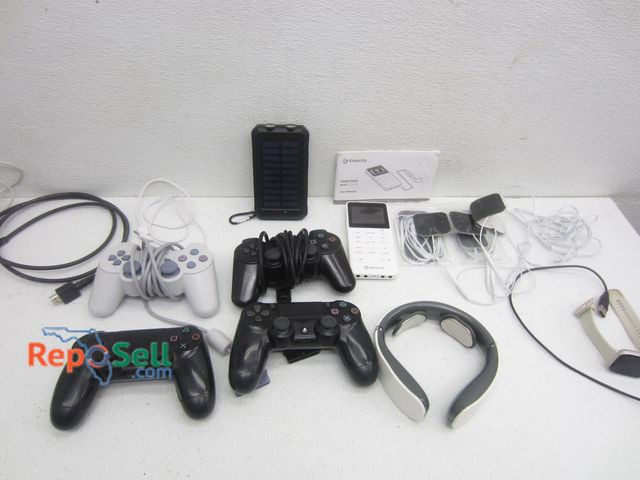 Lot 31-7152 - Electronics Lot: (4) PS Controllers, Solar Charger, Smart Watch, Etekcity Tens Unit etc.