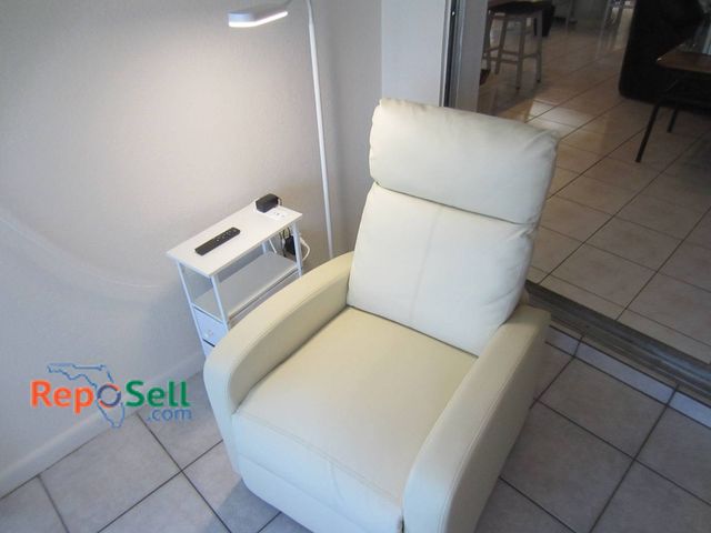 Lot 31-8607 - Electric Cream Massage Chair (powers on) With Power Controls, Remote, Table, And Lamp