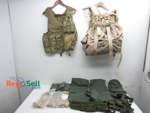 Lot 31-1050 - Lot of Military Gear: Backpack, Vests, Pants, Etc. Some New w/ Tags