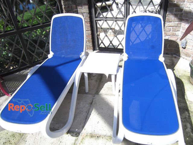 Lot 31-1407 - (2) Adjustable Chaise Lounge Chairs &amp; Side Table