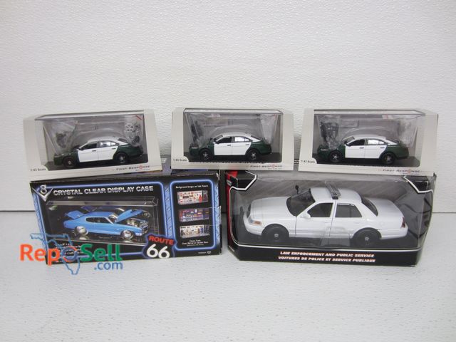 Lot 31-1235 - (4) New Inbox Diecast Police Cars and (1) Display Case: (3) are1:43 scale, (1) is 1:24 scale