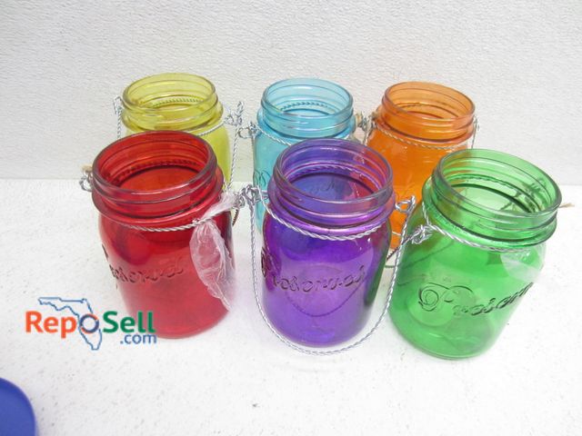 Lot 31-9421 - (6) preserves glass votive jars in assorted colors