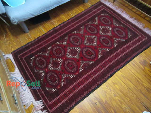 Lot 31-9048 - Handwoven Wool Rug Measuring Approximately 47 Inches By 76 Inches With Geometric Design.