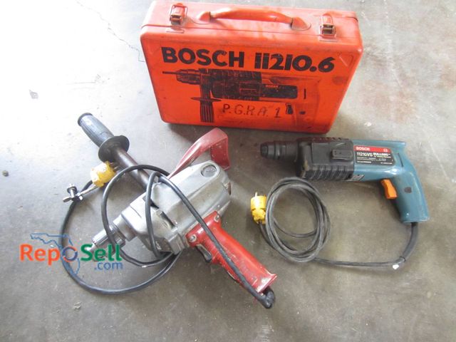Lot 31-1359 - A Bosch 11210.6 Rotary Hammer Drill, A Milwaukee 1610-1 Drill, And A Bosch-Branded Red Storage Case....