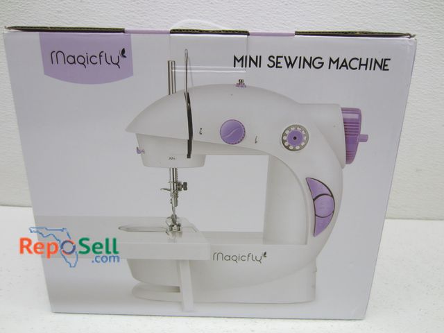 Lot 31-3239 - Magicfly Mini Sewing Machine - Powers On
