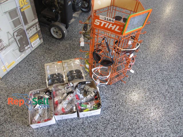 Lot 31-1184 - Stihl-branded metal display rack featuring multiple pairs of safety glasses, including packaged Stih...