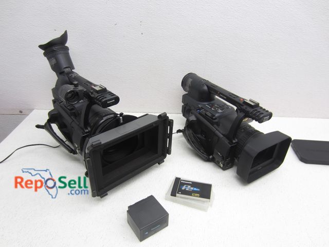 Lot 31-5246 - (2) Panasonic Cameras (both power on) - 3CCD, AG-HVX200P - One Battery